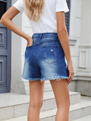 Shorts estivi in denim sfrangiato e consumato