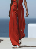 Lässiger Retro-Jumpsuit aus rotem Baumwoll-Leinen mit Reißverschluss, ärmellos, elastischer Taille und weitem Bein