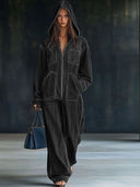 Lässiger weiter Retro-Jeans-Jumpsuit mit Kapuze, Reißverschluss, Taschen und langen Ärmeln