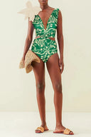 Traje de baño de una pieza verde con estampado y apliques florales