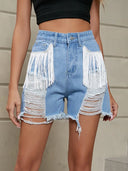 Shorts di jeans lavati con frange