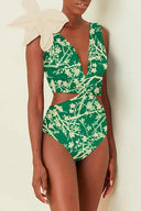 Traje de baño de una pieza verde con estampado y apliques florales