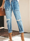 Pantaloni di jeans strappati con coulisse autunnali