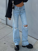 Jeans di jeans strappati alla moda a gamba larga svasata