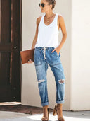 Pantaloni di jeans strappati con coulisse autunnali