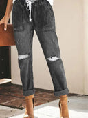 Pantaloni di jeans strappati con coulisse autunnali