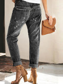 Pantaloni di jeans strappati con coulisse autunnali