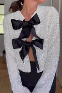 Giacca con paillettes e nodo frontale
