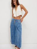 Plisserede jeans med knapper foran
