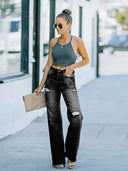 Pantaloni di jeans a vita alta strappati a gamba larga