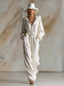 Lässiger weiter modischer weißer Cord-Jumpsuit mit Kapuze, Frontreißverschluss und langen Ärmeln
