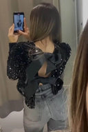 Giacca con paillettes e nodo frontale