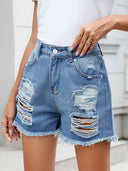 Shorts estivi in denim sfrangiato e consumato