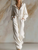 Lässiger weiter modischer weißer Cord-Jumpsuit mit Kapuze, Frontreißverschluss und langen Ärmeln