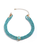 Collana corta con perle finte e perline turchesi