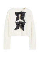 Giacca con paillettes e nodo frontale