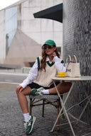 Maglione smanicato a trecce