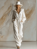 Lässiger weiter modischer weißer Cord-Jumpsuit mit Kapuze, Frontreißverschluss und langen Ärmeln