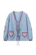 Blusa a maniche lunghe con cuori