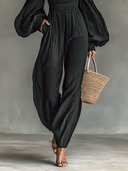 Damen-schulterfreier Jumpsuit mit langen Ärmeln und plissiertem Stoff
