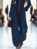 Combinaison décontractée ample rétro en denim rouge avec surpiqûres, jambes larges et manches longues